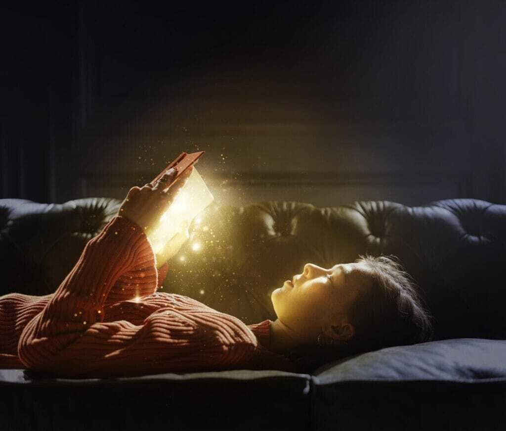 girl-reading-from-magical-glowing-book