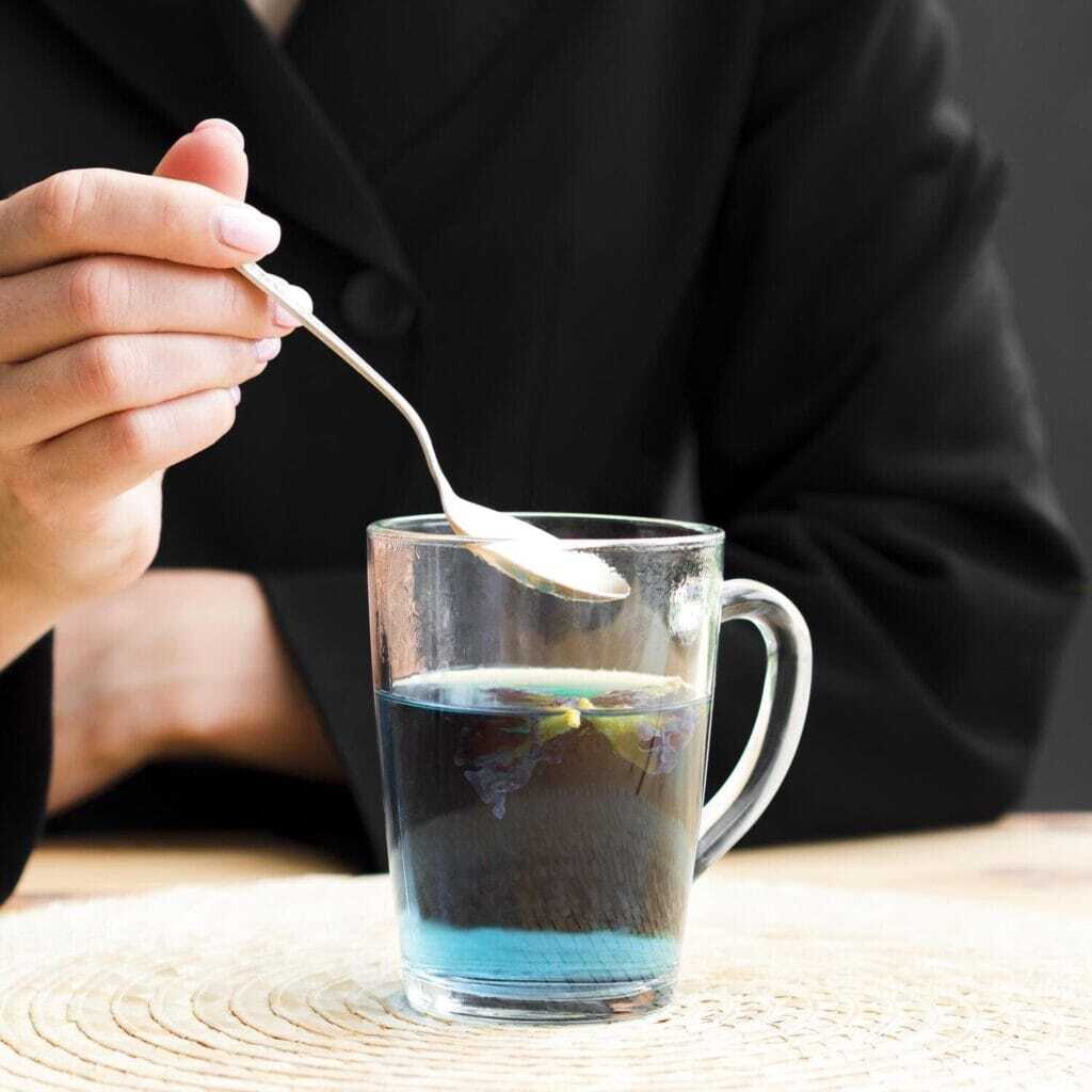 woman-taking-teaspoon-from-teacup