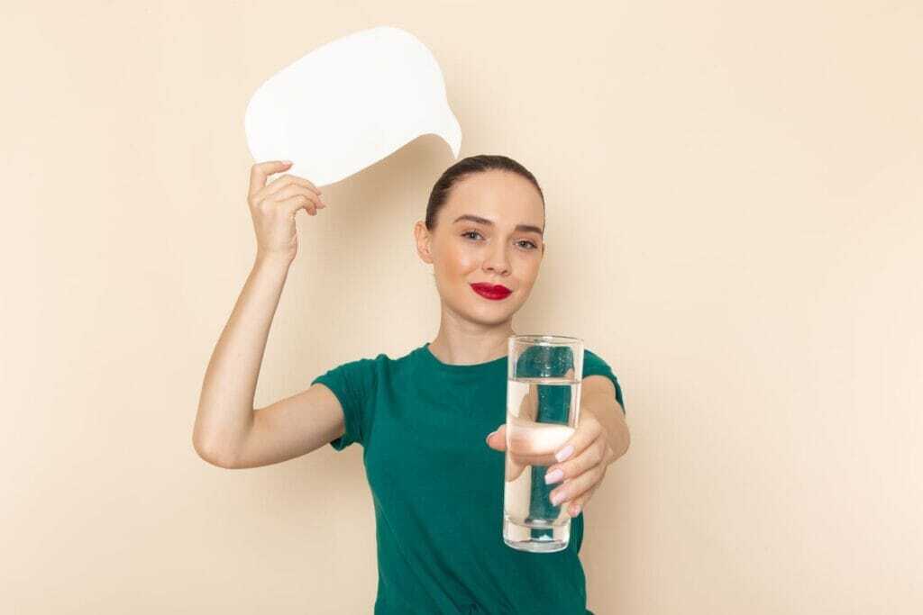 young-female-glass-water-sign-beige