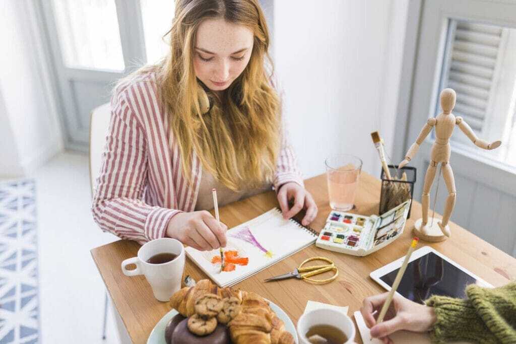young-woman-painting-sketchbook