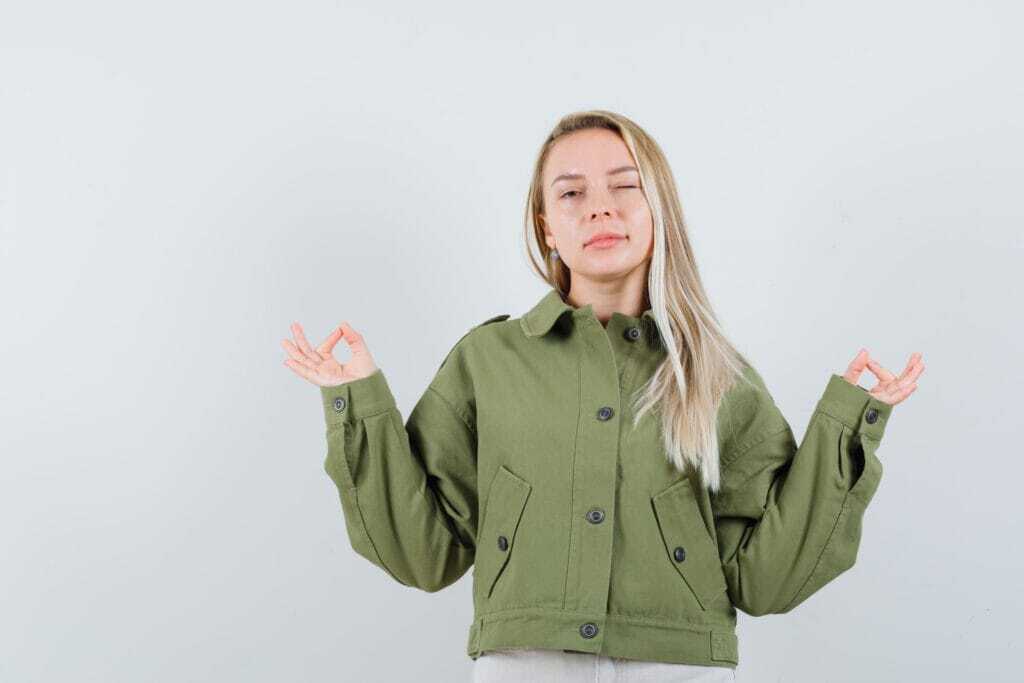 blonde-lady-meditation-gesture-jacket