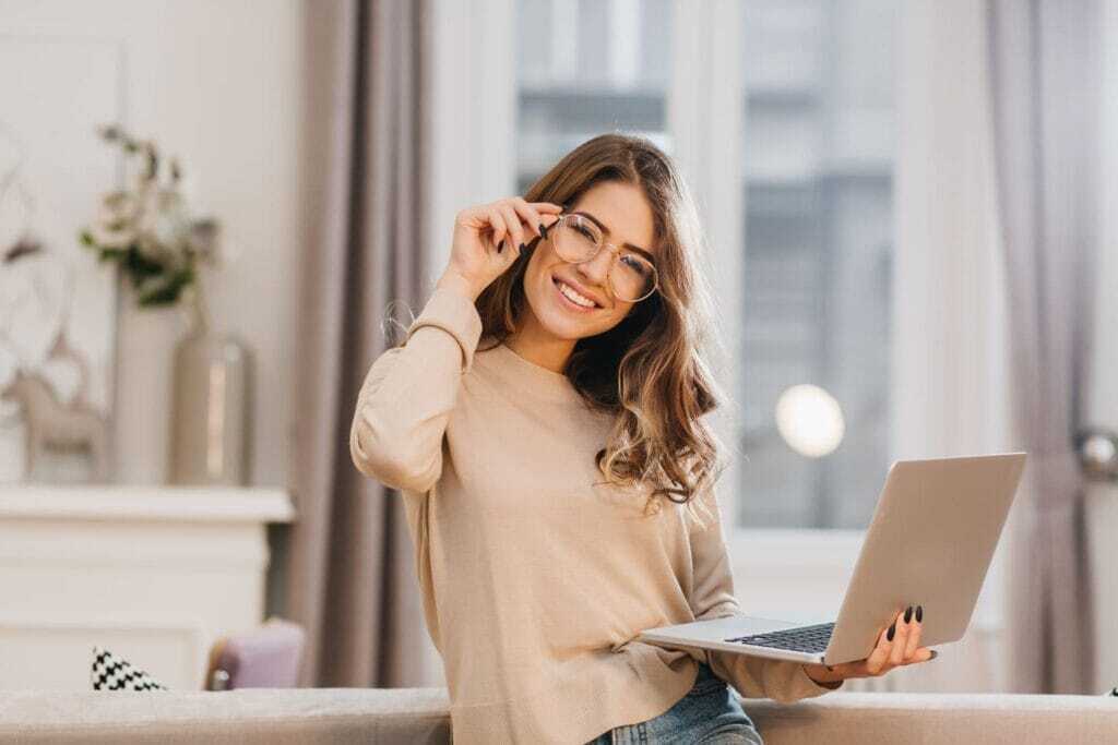 Freelancer Secrets: Proven Tips to Win More Jobs on Freelancer.com in 2025 65 girl-beige-shirt-touching-glasses-smile